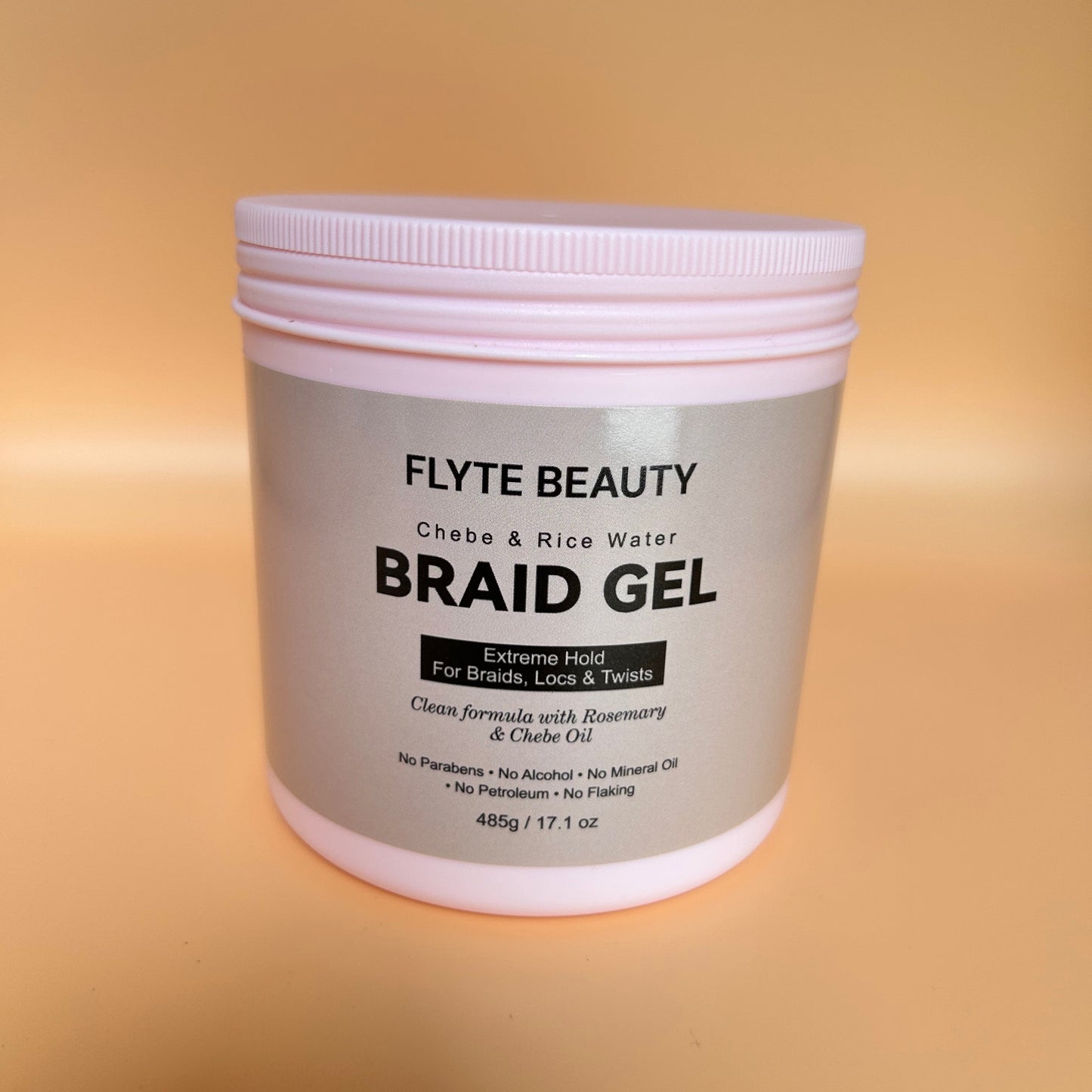 Flyte Beauty Braid Gel container on a gradient background