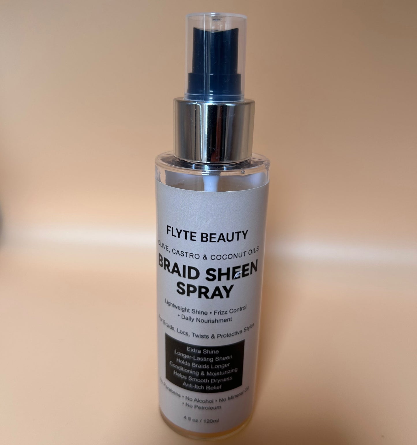 Braid Sheen Spray bottle by Flyte Beauty on a beige background