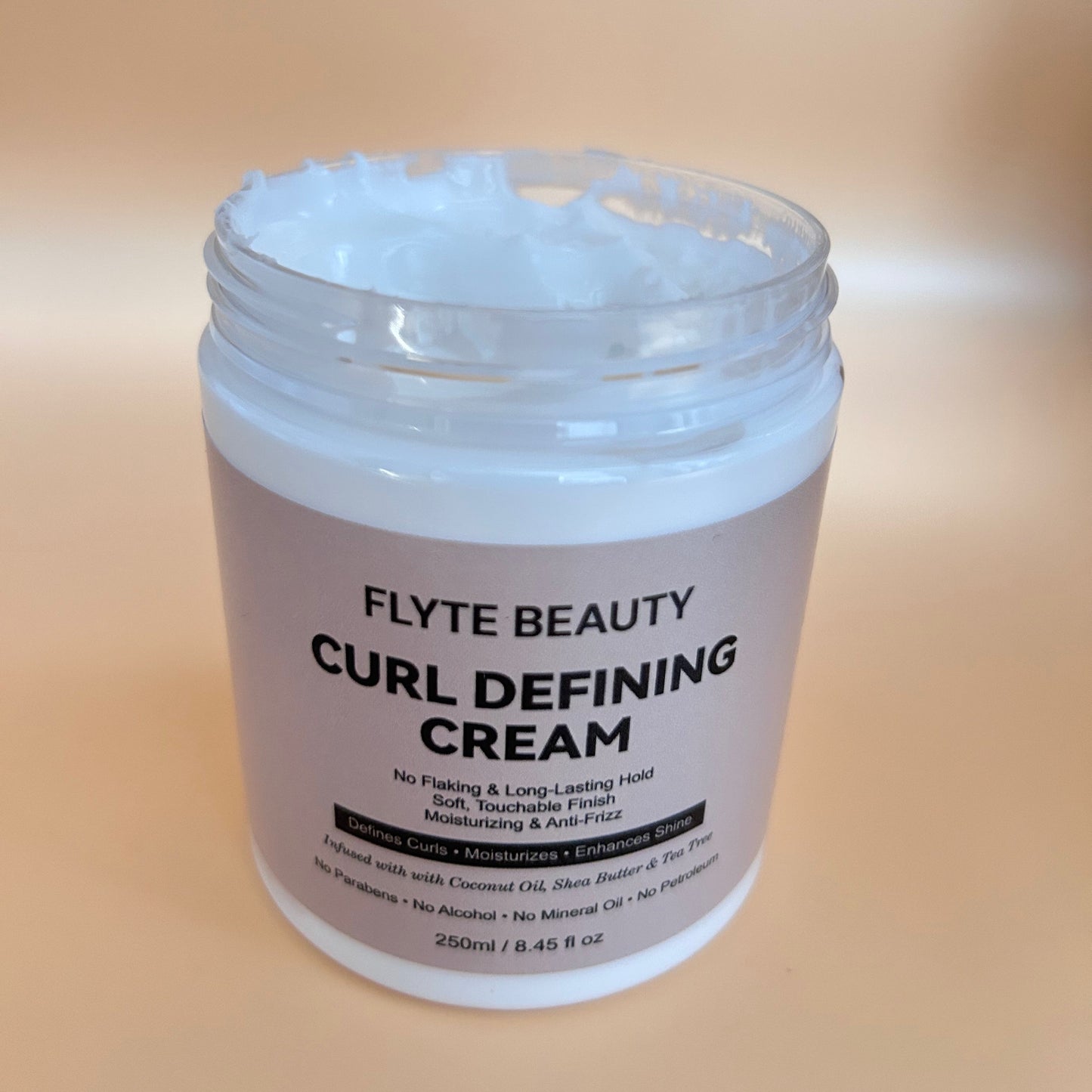Jar of Flyte Beauty Curl Defining Cream on a beige background